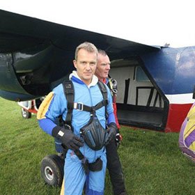 Glenn Harrold preparing to skydive from 13,000 feet