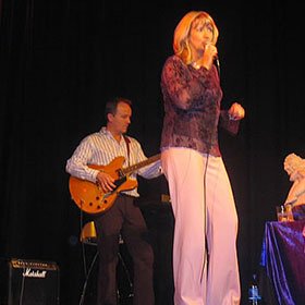 Glenn Harrold performing one of his songs with Aly